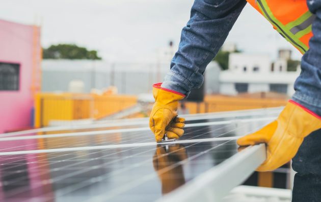 Selective Focus on Maintenance Man Installing Solar Panel